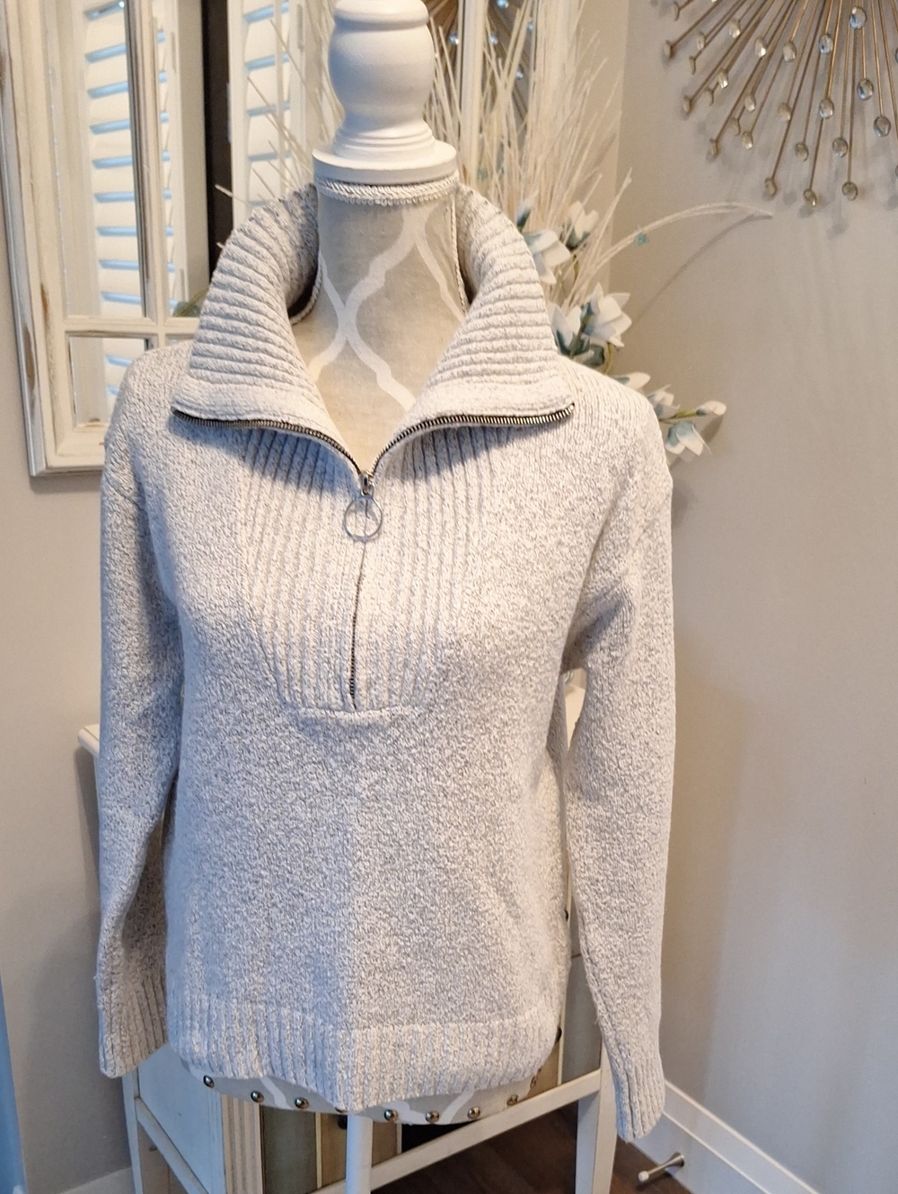Heathered sweater with cowelneck zipper.